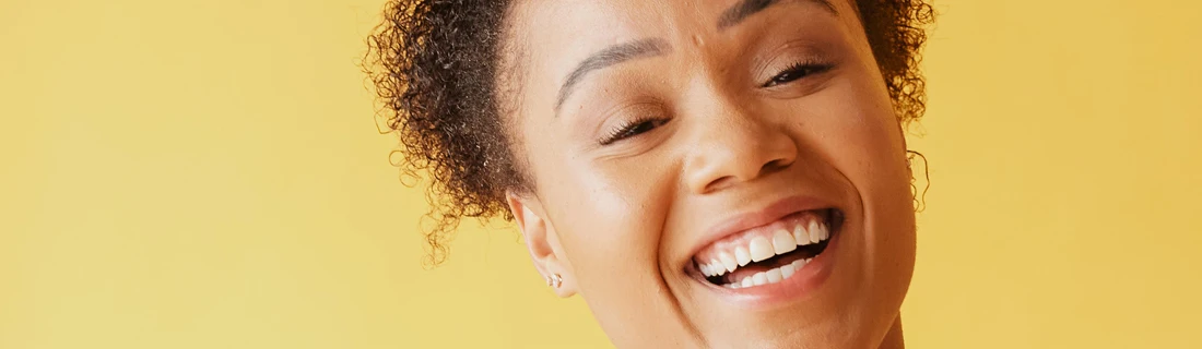 Close up Of A Smiling Woman Showing Her Teeth Happily